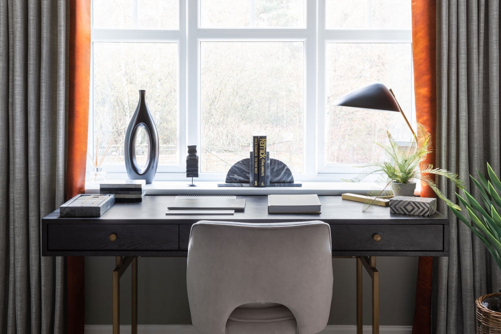 Dark office with grey and orange curtains